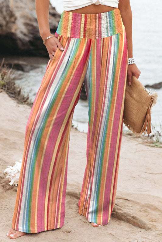 Multicolor Striped Smocked High Waisted Wide Leg Beach PantsMaterial:100%Polyester



		Made of lightweight and breathable fabric perfect for the beach or summer days.
	
	
		Features a smocked high waist design for a fla