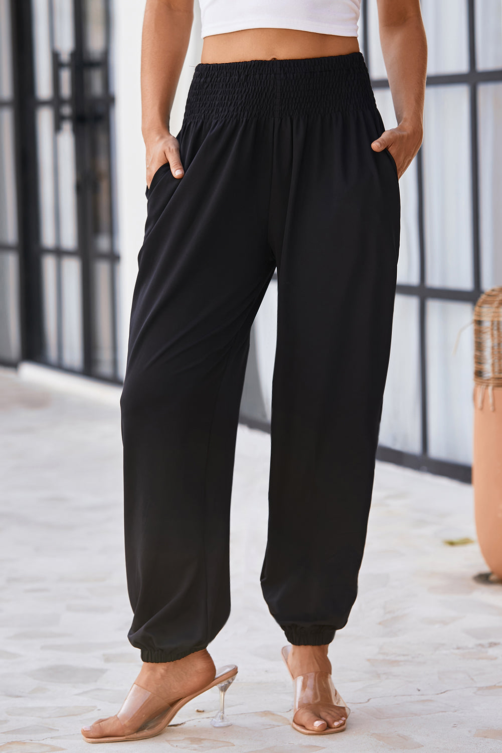 Black Pocketed Smocked High Waist JoggersMaterial:95%Polyester+5%Elastane



		These jogger pants are very cozy to wear with 95%Polyester+5%Elastane made
	
	
		The smocked design adds a stylish touch a