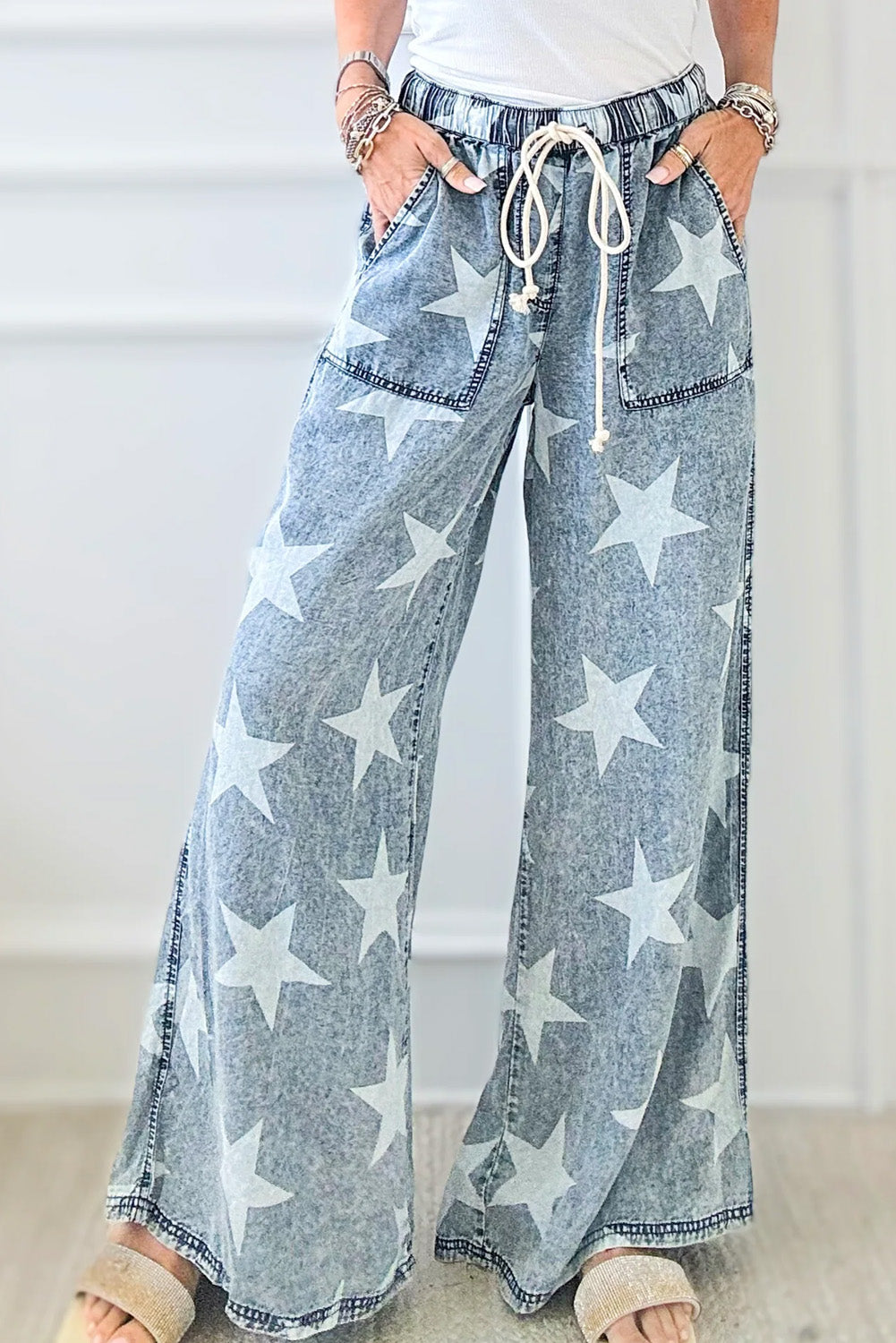 Light Blue Star Print Light Wash Drawstring High Waist Wide Leg JeansMaterial:82%Cotton+10%Polyester+8%Viscose

• Elevate your casual look with these light blue star print high waist jeans, featuring a trendy wide leg design for a ch