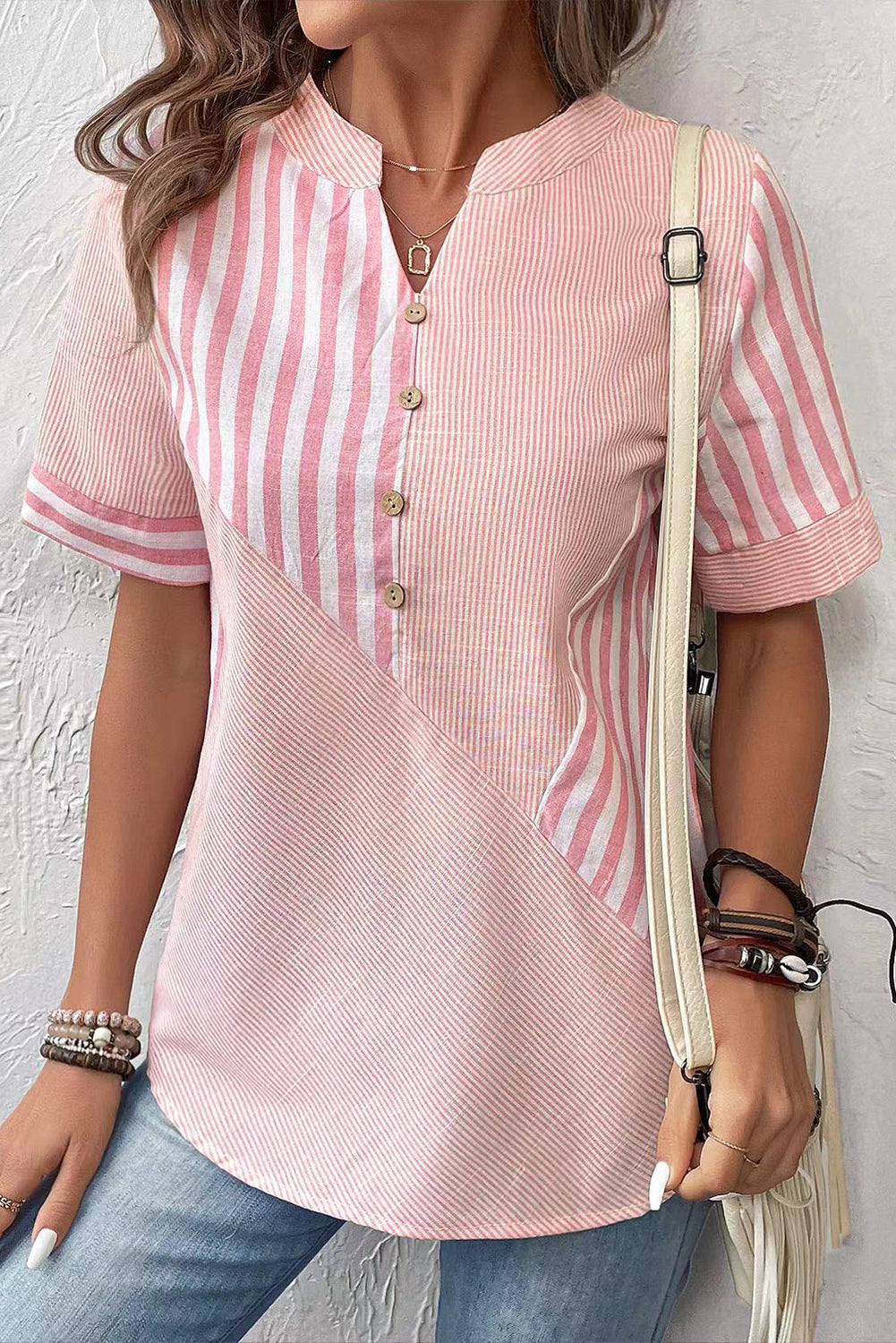 Pink Stripe Henley V-neck Patchwork Blouse• The chic patchwork design adds a trendy touch to the classic V-neck silhouette, offering a unique and fashionable look. 
• Crafted from high-quality fabric, this 