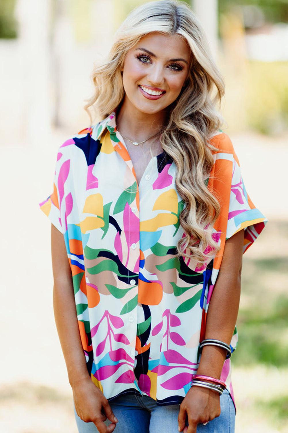 Multicolour Abstract Leaf Print Button Up Short Sleeve BlouseMaterial:100%Polyester

• Infuse your wardrobe with vibrancy in this blouse, perfect for a relaxed yet stylish look.
• The button-up design adds a touch of sophist