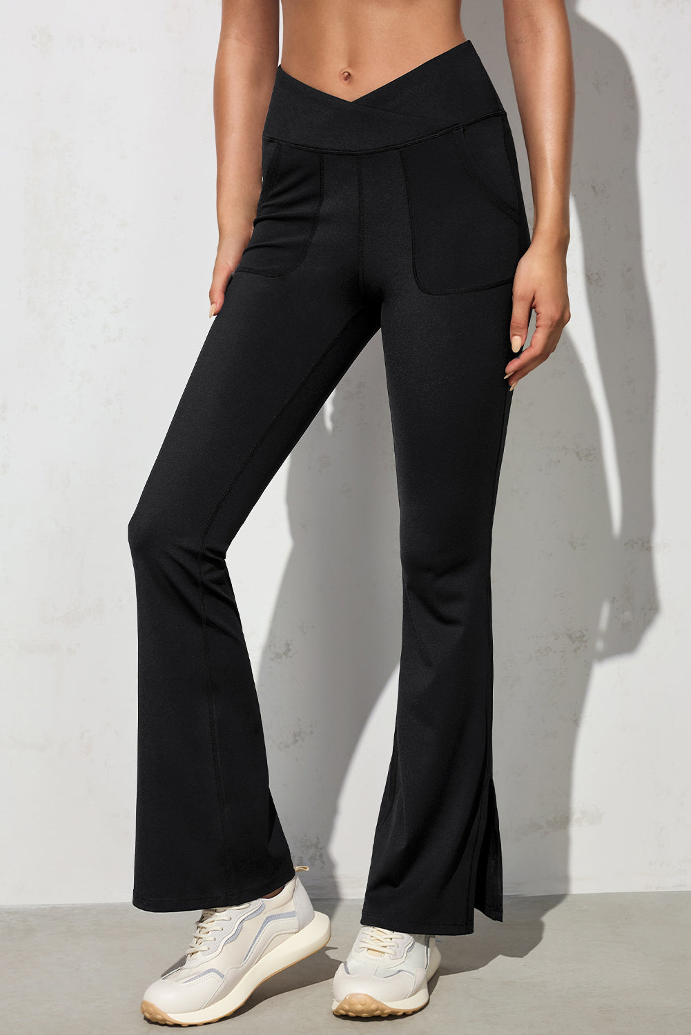 Black Cross Waist Pocketed Split Hem Flared LeggingsMaterial:75%Polyamide+25%Elastane



		Elevate your everyday look with these stylish pants made from soft, high-quality material that offers a comfortable stretch 