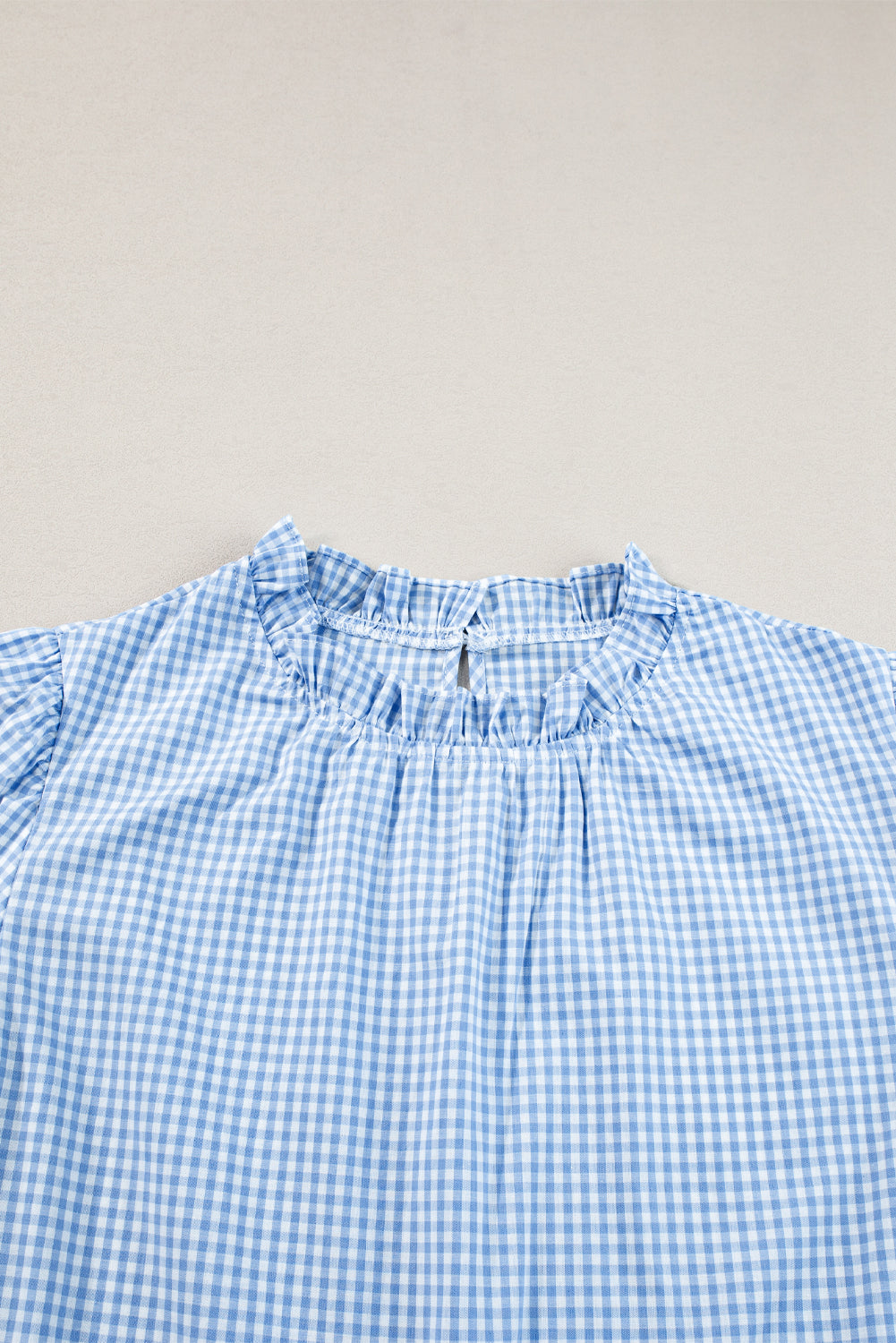 Light Blue Flower Embroidered Puff Sleeve Gingham BlouseMaterial:100%Cotton

• Elevate your casual look with our blouse, featuring intricate floral embroidery on a classic gingham pattern.
• The puff sleeves add a touch