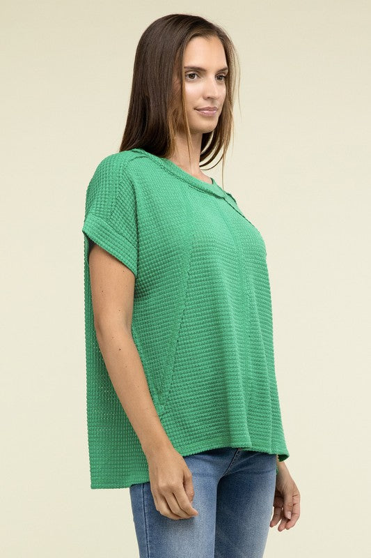 Brushed Waffle Exposed-Seam Short Sleeve TopElevate your casual wardrobe with this Brushed Waffle Top, featuring side slits, exposed seam details, and a stylish hi-low hem. Perfect for a relaxed yet trendy loo