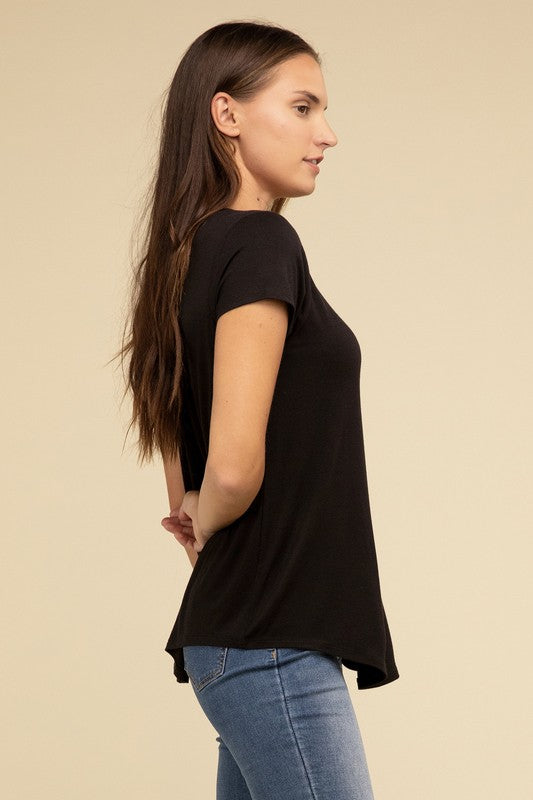 Flowy Round Hem Rayon Short Sleeve TopThe Flowy Round Hem Rayon Short Sleeve Top is the perfect addition to your casual wardrobe. Crafted from soft, lightweight rayon, this top features a relaxed fit and