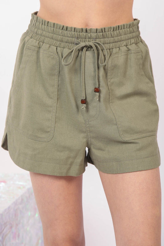 VERY J Drawstring Elastic Waist Linen ShortsStay cool and comfortable in these Elastic Waist Solid Linen Shorts featuring side pockets and a round hem for added style. These Cool Comfort Eco-Friendly Recycling