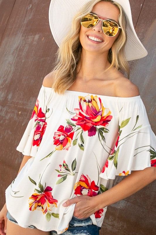 FLORAL OFF SHOULDER TOPFLORAL PRINT JERSEY ELASTICIZED OFF SHOULDER TOP- Floral off shoulder top- Elasticized off shoulder neckline- Ruffle short sleeves- Loose fit- Allover floral print j