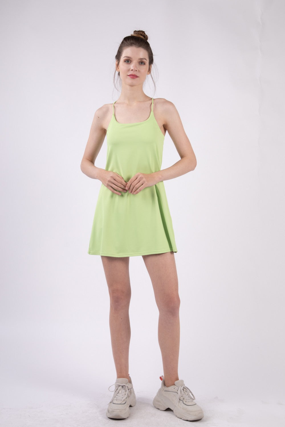 VERY J Sleeveless Active Tennis Dress with Unitard LinerThe sleeveless active tennis dress features a sleek design and a unitard liner for added comfort and support. It is perfect for rigorous tennis matches or training s