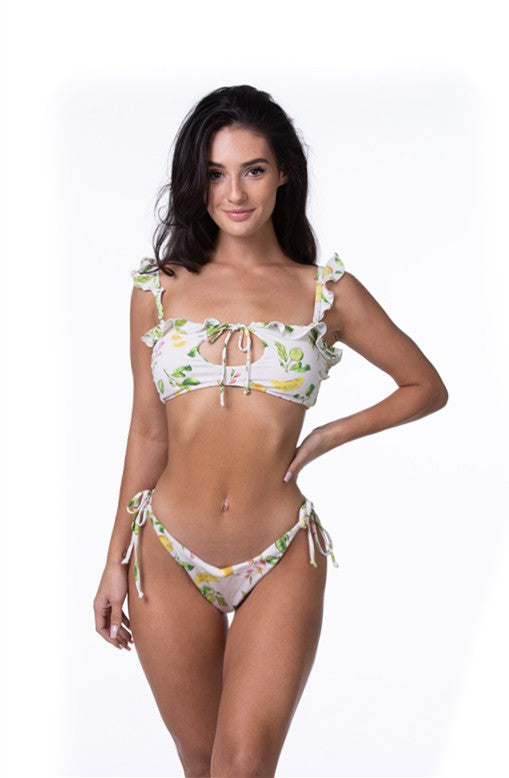 LEMON RUFFLE BIKINI SETLemon print bikini set with ruffle details. Top with front keyhole and tie closure, adjustable shoulder straps, and removable pads. Tie side bottom with moderate cov