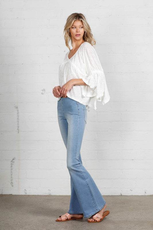 Mid Rise Banded Wide Flare JeansMid Rise Banded Wide Flare Jeans- 68% Cotton, 28% Polyester, 2% Rayon, 2% Spandex- Stretch Denim- Wide Flare Leg- Imported, Designed In USASize S- Waist 26 1/2"- Hip