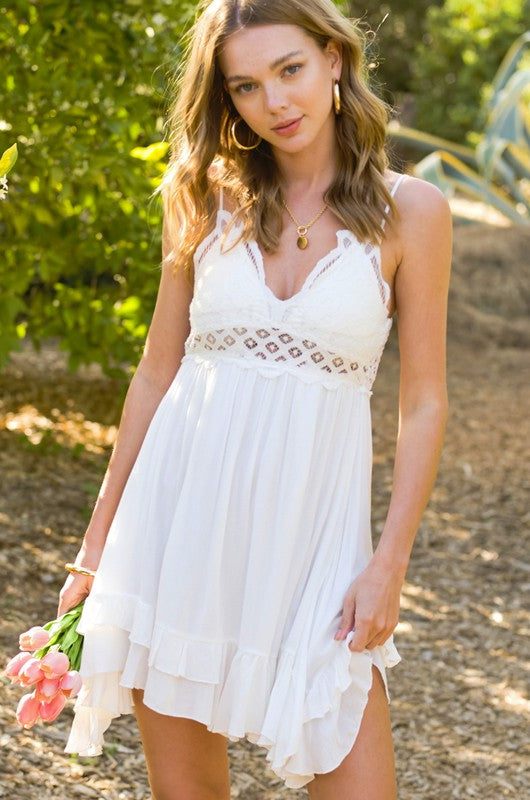 Monterey DressGo-to slip dress featuring beautiful bralette at the top with boho crochet lace details and adjustable double shoulder straps. Smocked back and a light airy skirt wi