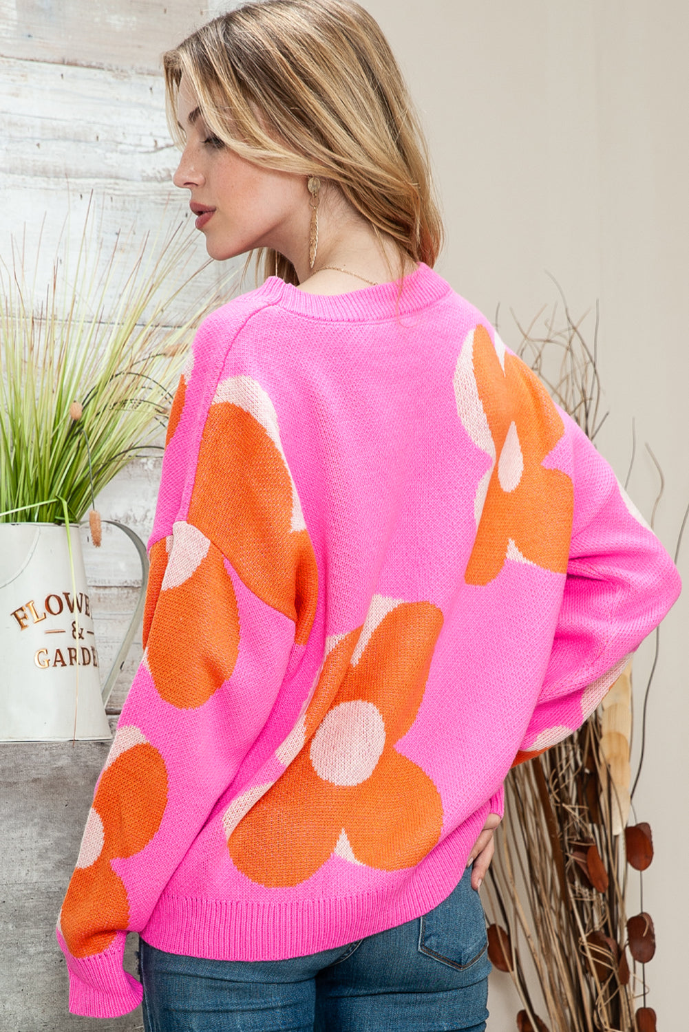 Pink & Orange 60s Floral Cable Knitted SweaterMaterial:100%Acrylic



		Add a pop of color and style to your wardrobe with our Pink &amp; Orange Floral Cable Knitted Sweater. This sweater features a vibrant fl