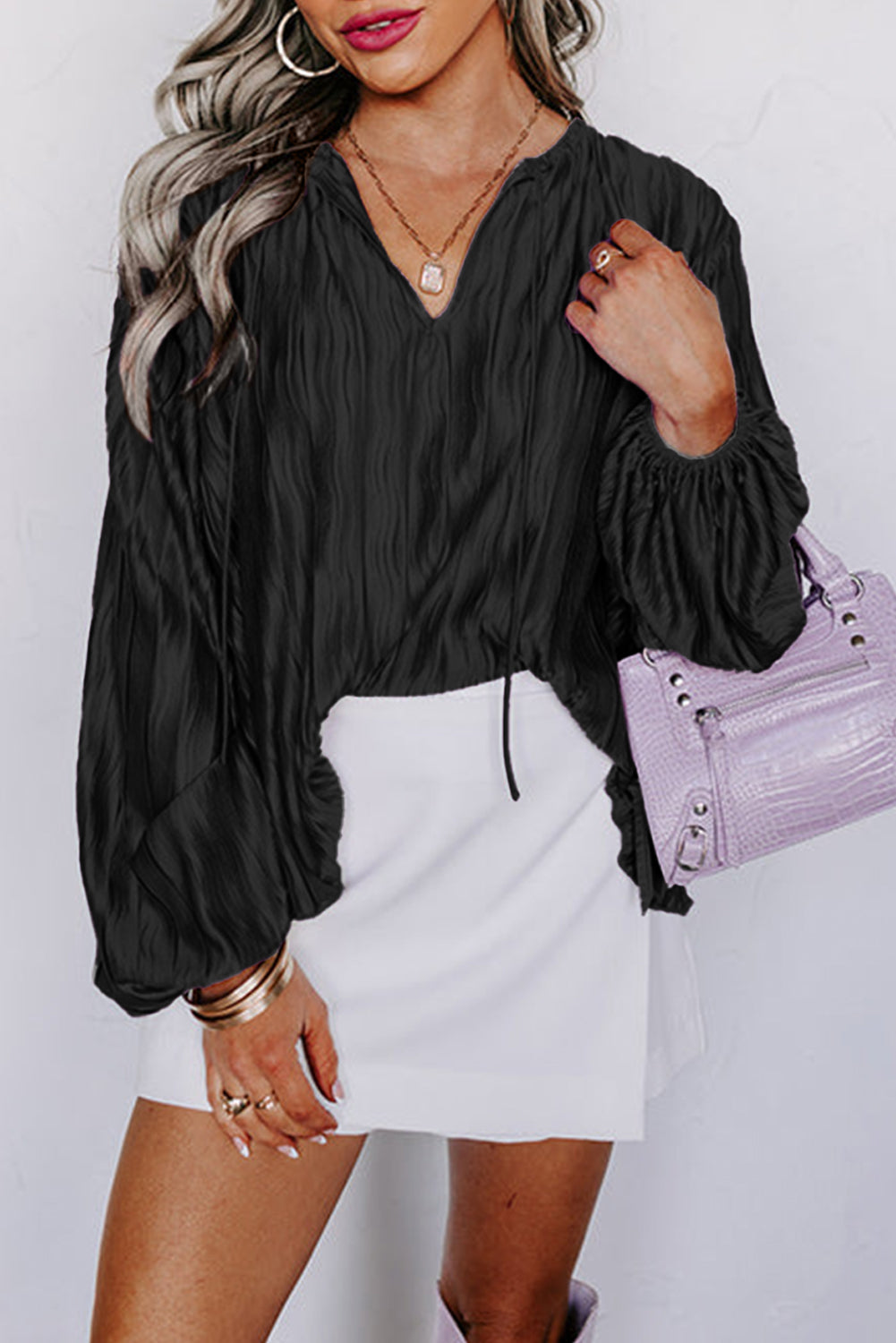 Black Textured Bubble Sleeve V Neck Loose BlouseMaterial:100%Polyester

• Effortlessly chic, this black textured blouse features bubble sleeves that add a touch of playfulness to your outfit, perfect for daily we