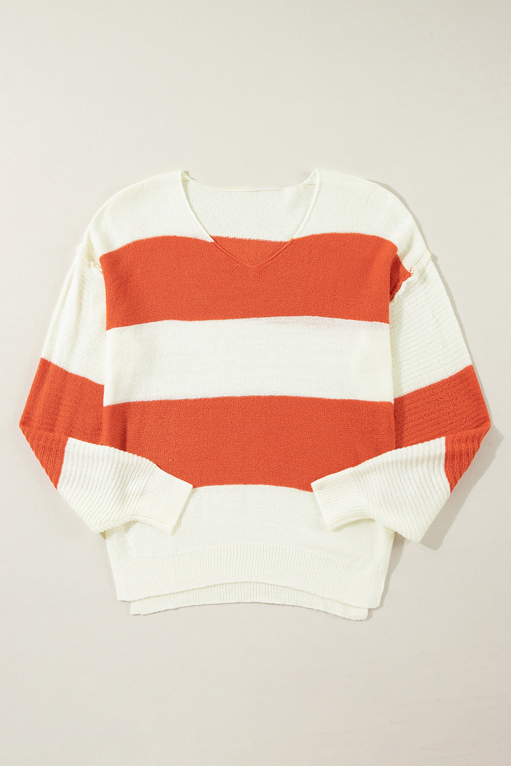 Orange Colorblock V Neck Side Slits SweaterMaterial:100%Acrylic

• Stand out in style with our sweater, blending casual stripes with a trendy rib-knit design.
• The vibrant orange hues add a pop of color to