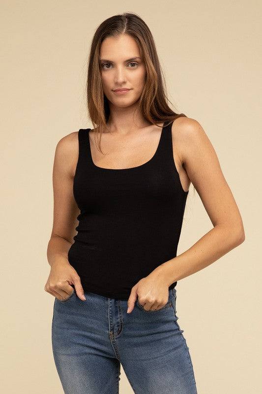 Double Layer Round Neck Tank TopThe Double Layer Round Neck Tank Top offers a stylish and comfortable option for any wardrobe. Featuring a classic round neckline and a unique double-layer design, t