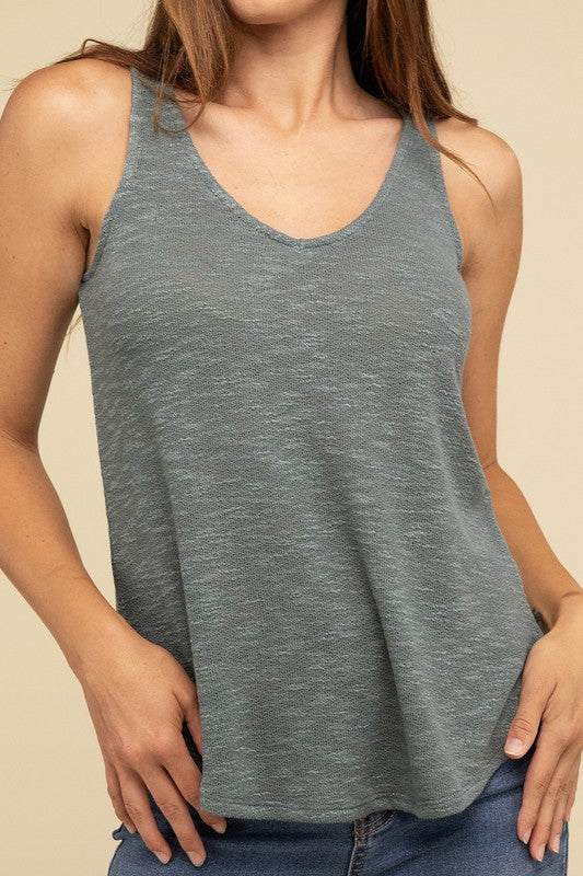 V Neck Sleeveless Cami TopThe V Neck Sleeveless Cami Top is a chic and versatile addition to any wardrobe. Featuring a flattering V neckline and a sleeveless design, this cami top is perfect 