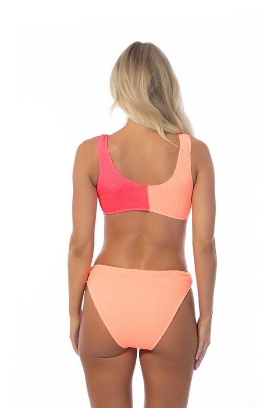 TEXTURED TWO TONE RING ACCENT BIKINI SETTwo-tone color blocking textured bikini set featuring a bandeau top with wooden ring detail and removable pads. Matching with a mid-waist two-tone bottom with wooden