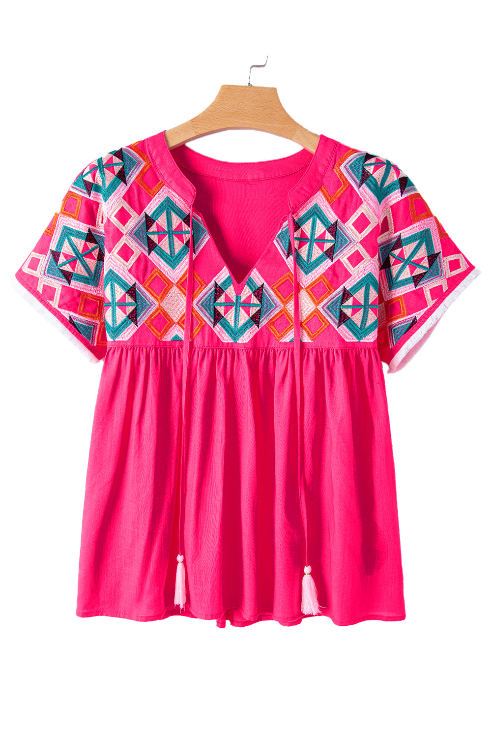 Strawberry Pink Geometric Embroidered Tassel Tie V Neck BlouseMaterial:100%Cotton



		The blouse is a stylish and bohemian-inspired top that combines geometric embroidery with tassel details.
	
	
		This blouse features a 