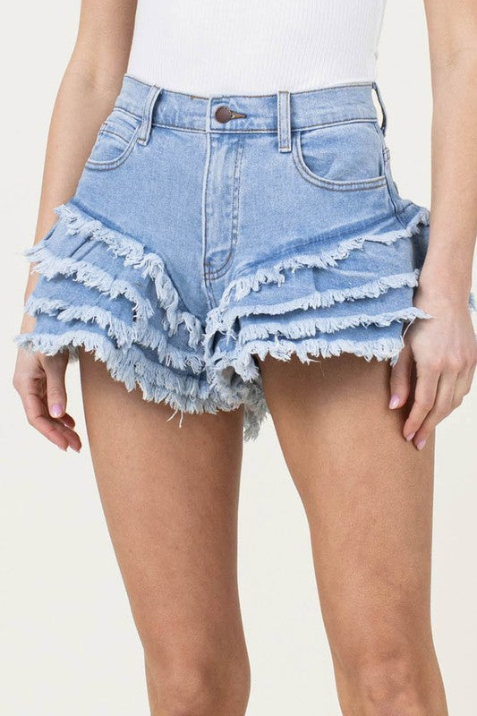 Fringe Denim ShortsStep up your denim game with these Fringe Denim Shorts. These shorts offer a dramatic and playful twist with their layered cut fringe, adding a fun and trendy vibe t