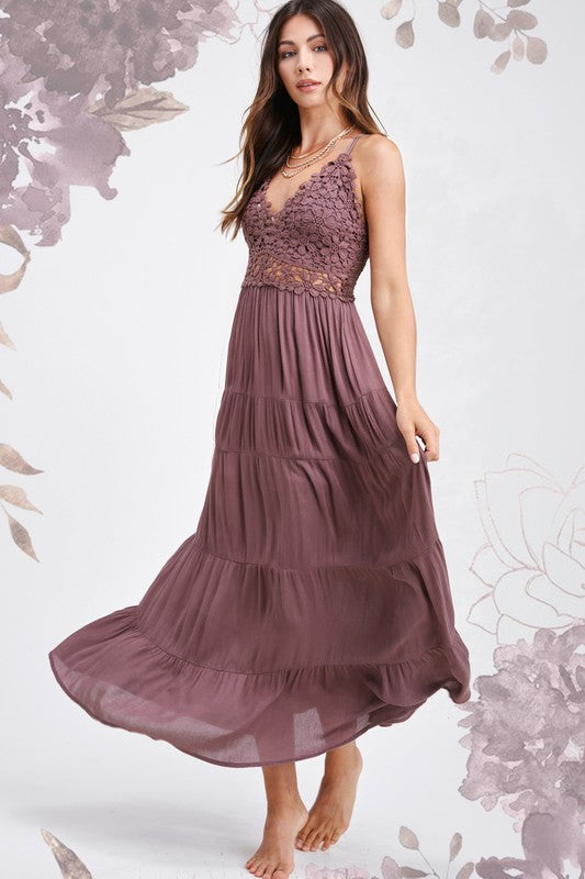 Ollie DressThe Ollie Dress is the embodiment of bohemian charm, featuring a flowing maxi silhouette adorned with intricate crochet lace trim that gracefully accents the bodice 