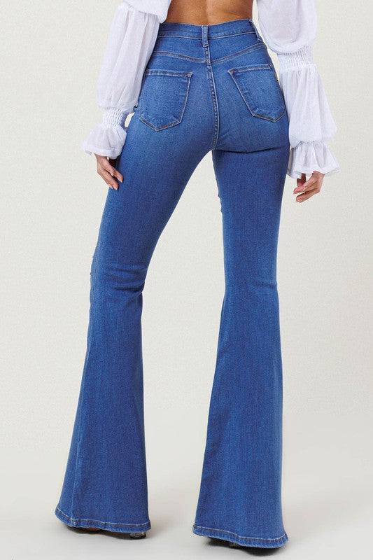 High-Rise Distressed Flare JeansMake a bold fashion statement with these High-Rise Distressed Flare Jeans. Designed for those who want to stand out, these jeans feature subtle distressing on the fr