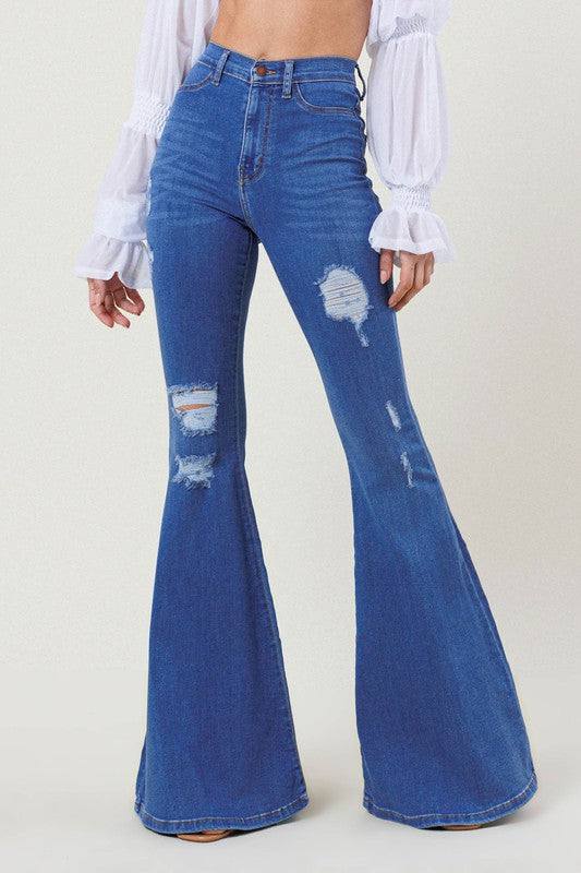 High-Rise Distressed Flare JeansMake a bold fashion statement with these High-Rise Distressed Flare Jeans. Designed for those who want to stand out, these jeans feature subtle distressing on the fr