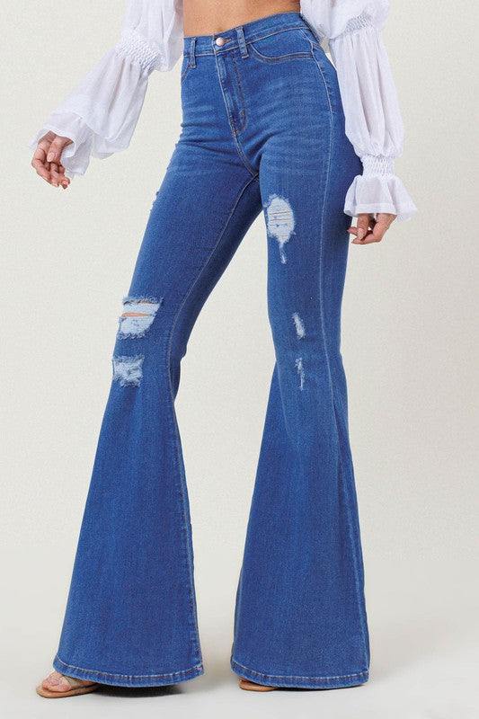 High-Rise Distressed Flare JeansMake a bold fashion statement with these High-Rise Distressed Flare Jeans. Designed for those who want to stand out, these jeans feature subtle distressing on the fr