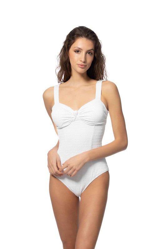 TEXTURED SOLID ONE PIECE SWIMSUIT WITH KNOT FRONTSolid textured one piece swimsuit features center knot detailing, removable pads, and back hook closure. Adjustable wide shoulder straps for added comfort. Ruched ba