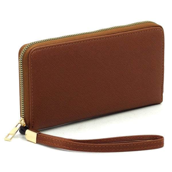 Saffiano Zip Around Wallet WristletSaffiano Zip Around Wallet Wristlet Faux vegan leather Zip around closure Gold-tone hardware Detachable wrist band L 7.75 * H 4.25 * W 1