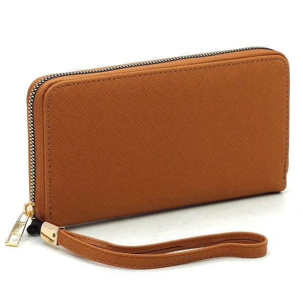 Saffiano Zip Around Wallet WristletSaffiano Zip Around Wallet Wristlet Faux vegan leather Zip around closure Gold-tone hardware Detachable wrist band L 7.75 * H 4.25 * W 1