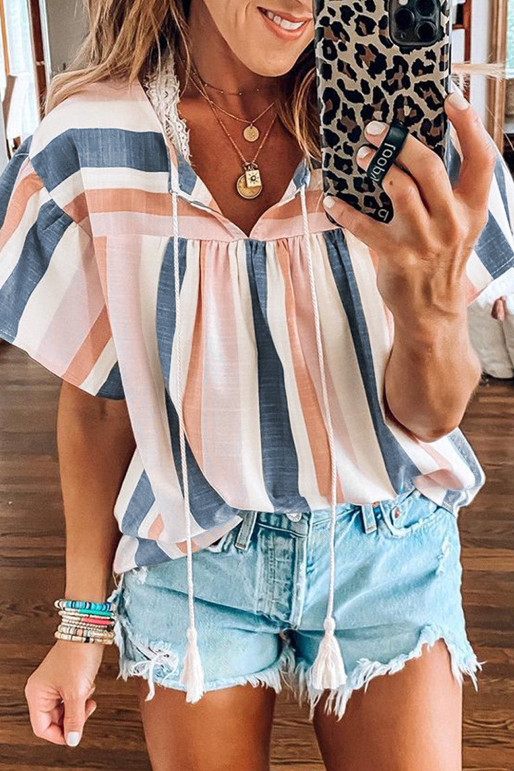 Pink and Blue Stripes Shirt Flutter Sleeve V Neck BlouseMaterial:100%Polyester


	•This simple striped print top looks very stylish and casual, and you'll get a lot of compliments wearing it 


	•Drawstring neckline 