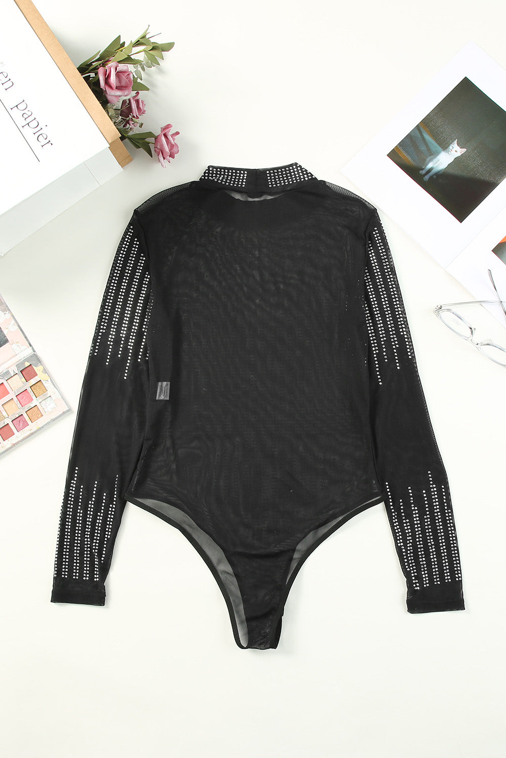 Black Rhinestone Sheer Slim Fit Long Sleeve BodysuitMaterial:95%POLYESTER+5%ELASTANE



		This sheer mesh bodysuit is sexy and charming for women
	
	
		The rhinestone design can light up your special nights
	
	