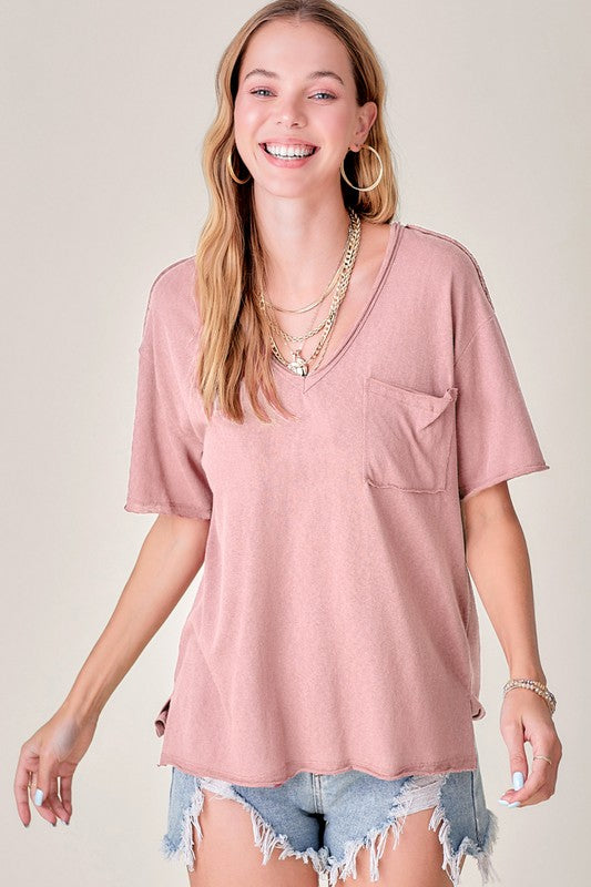 Halsey TopThe perfect tee for any style! Our effortless top featured in a boxy and super relaxed fit, short sleeves, front patch pocket, pleated back detailing, high-low hemli