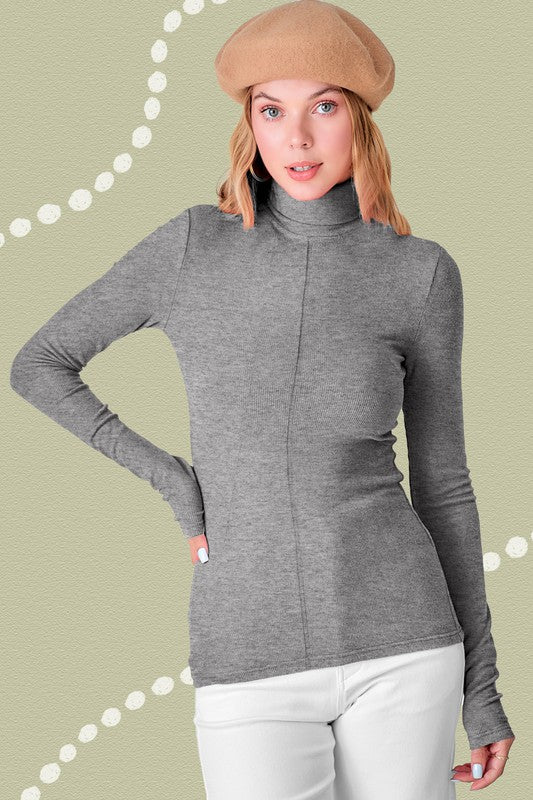 Julie TopEssential turtleneck featured in a slim silhouette with a soft and stretchy fit. Perfect layering piece underneath any shirt or jackets. Basic piece but looks specia