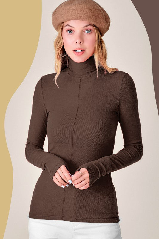 Julie TopEssential turtleneck featured in a slim silhouette with a soft and stretchy fit. Perfect layering piece underneath any shirt or jackets. Basic piece but looks specia