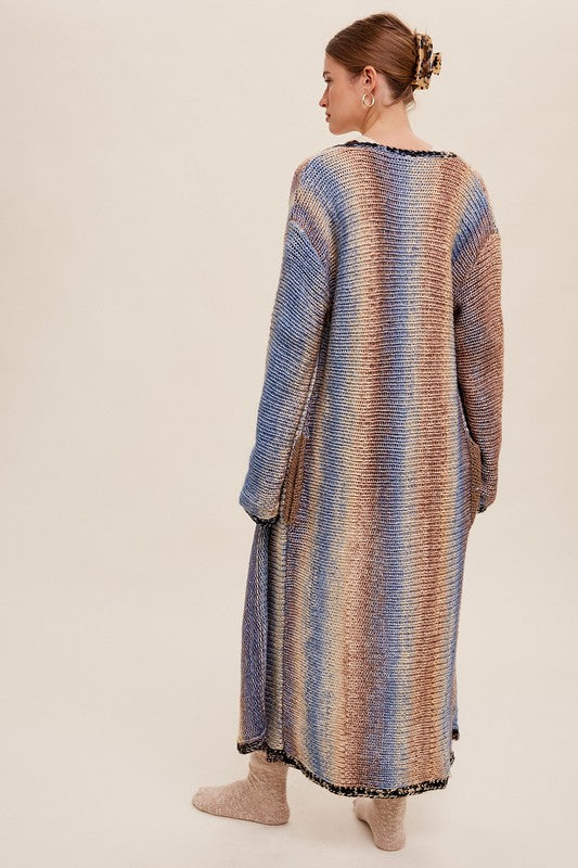 Multi Color Gradation Long Knit Open CardiganThis cardigan redefines versatility with its multi-color gradation design, offering a dynamic and eye-catching look. Crafted with meticulous attention to detail, the