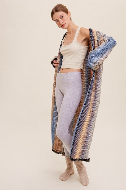 Multi Color Gradation Long Knit Open CardiganThis cardigan redefines versatility with its multi-color gradation design, offering a dynamic and eye-catching look. Crafted with meticulous attention to detail, the