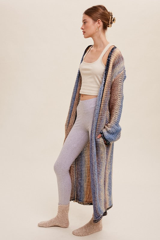 Multi Color Gradation Long Knit Open CardiganThis cardigan redefines versatility with its multi-color gradation design, offering a dynamic and eye-catching look. Crafted with meticulous attention to detail, the