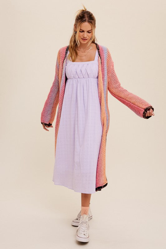 Multi Color Gradation Long Knit Open CardiganThis cardigan redefines versatility with its multi-color gradation design, offering a dynamic and eye-catching look. Crafted with meticulous attention to detail, the