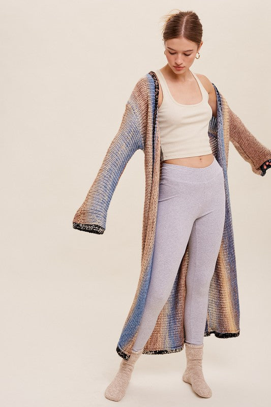 Multi Color Gradation Long Knit Open CardiganThis cardigan redefines versatility with its multi-color gradation design, offering a dynamic and eye-catching look. Crafted with meticulous attention to detail, the