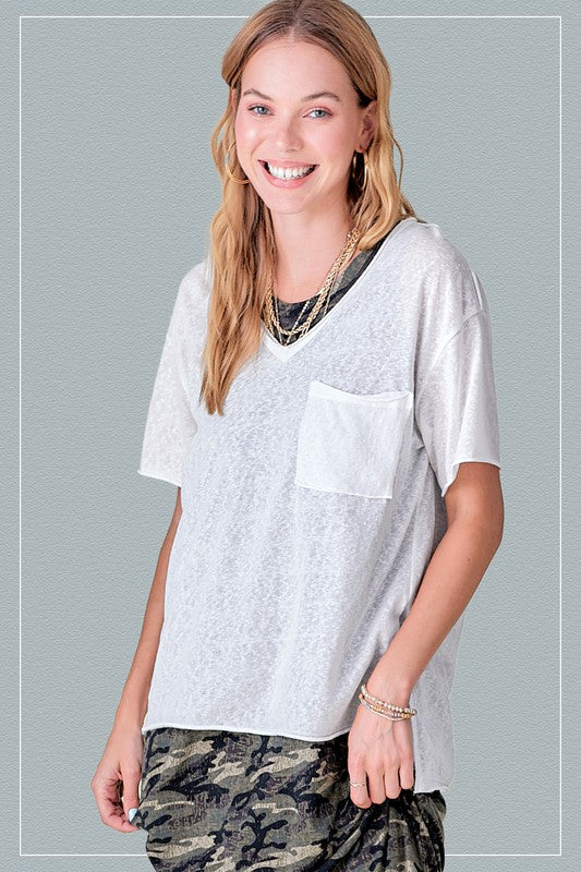 Halsey TopThe perfect tee for any style! Our effortless top featured in a boxy and super relaxed fit, short sleeves, front patch pocket, pleated back detailing, high-low hemli