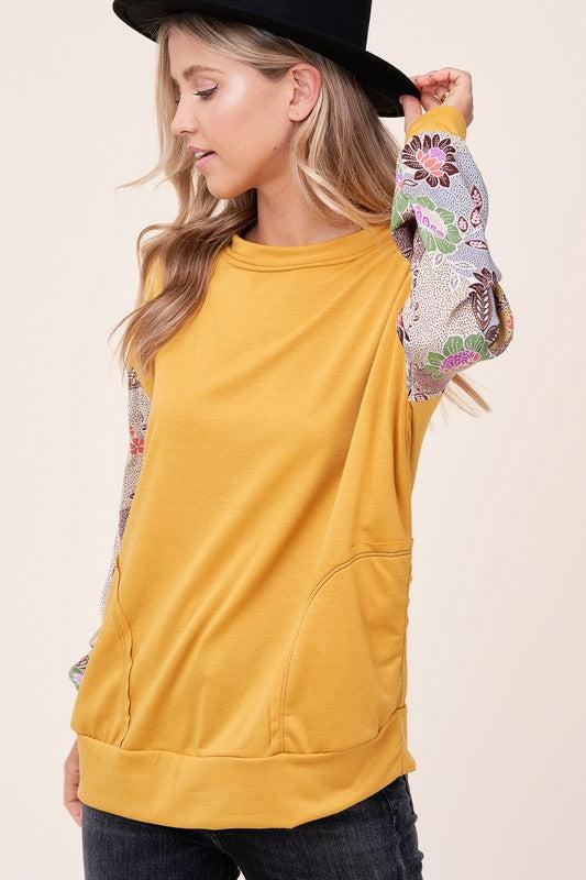 WOVEN FLORAL MIXED TOPFRENCH TERRY SOLID AND WOVEN FLORAL PRINT MIXED LONG SLEEVE SIDE POCKET RAW EDGE DETAIL TOP - MADE IN U.S.A.
Style: Casual
Print / Pattern: SOLID AND WOVEN FLORAL 
F