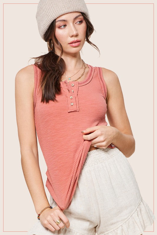 Kealy TopEffortlessly versatile ribbed cotton henley top with fitted silhouette tank with button front, contrast stitching, and exposed details.* Having trouble matching pict