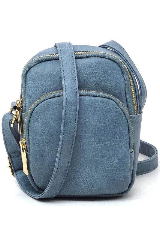 Calin Cell Phone Purse Crossbody BagCalin Crossbody BagFaux vegan leatherZip top closureGold-tone hardwareAdjustable shoulder strapL 5.5 * H 7.5 * W 2.3