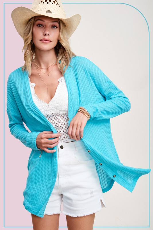 Greta CardiganWrap yourself in comfort and style with this casual cardigan made from soft and stretchy waffle fabric. It's perfect for layering or wearing on its own, making it a 