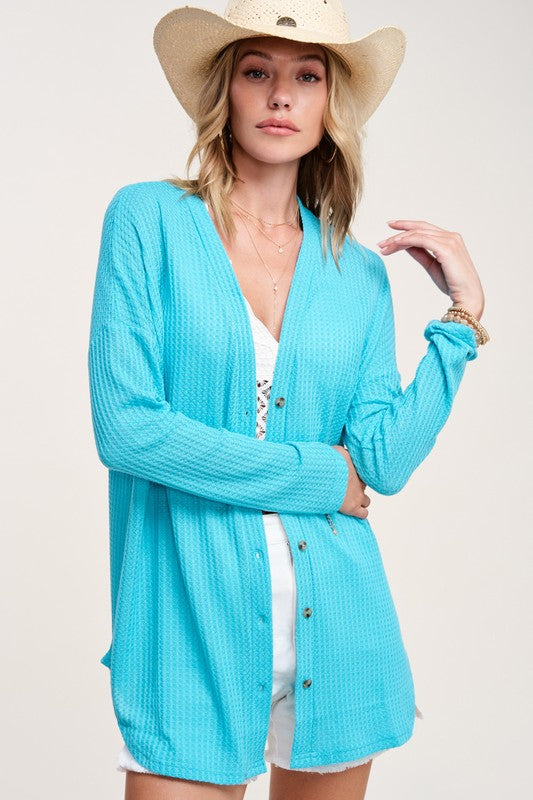 Greta CardiganWrap yourself in comfort and style with this casual cardigan made from soft and stretchy waffle fabric. It's perfect for layering or wearing on its own, making it a 