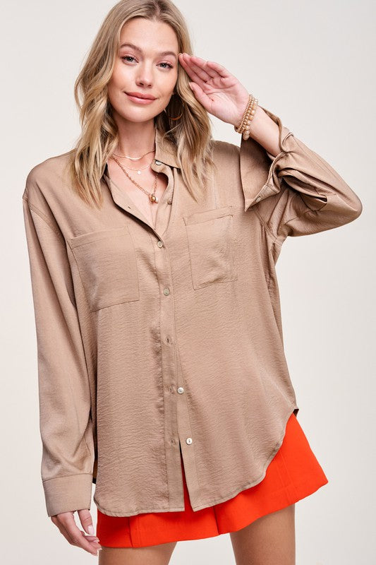 Hazel TopA stunning and versatile button-down shirt that exudes elegance and sophistication with its silky appearance. This top features a captivating silky texture and is ad