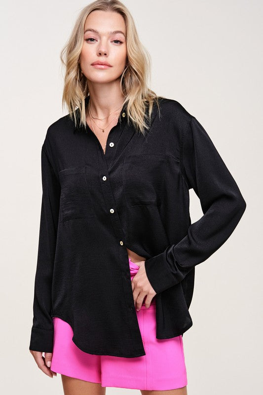 Hazel TopA stunning and versatile button-down shirt that exudes elegance and sophistication with its silky appearance. This top features a captivating silky texture and is ad