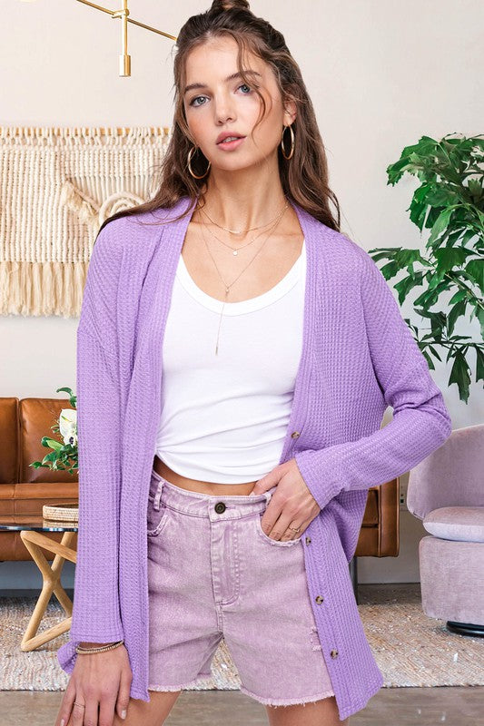 Greta CardiganWrap yourself in comfort and style with this casual cardigan made from soft and stretchy waffle fabric. It's perfect for layering or wearing on its own, making it a 