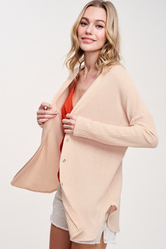 Greta CardiganWrap yourself in comfort and style with this casual cardigan made from soft and stretchy waffle fabric. It's perfect for layering or wearing on its own, making it a 